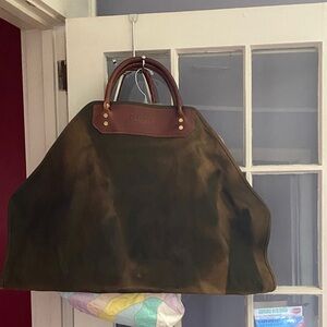 ORVIS this is a heavy-duty waxed canvas and leather firewood log carrier tote